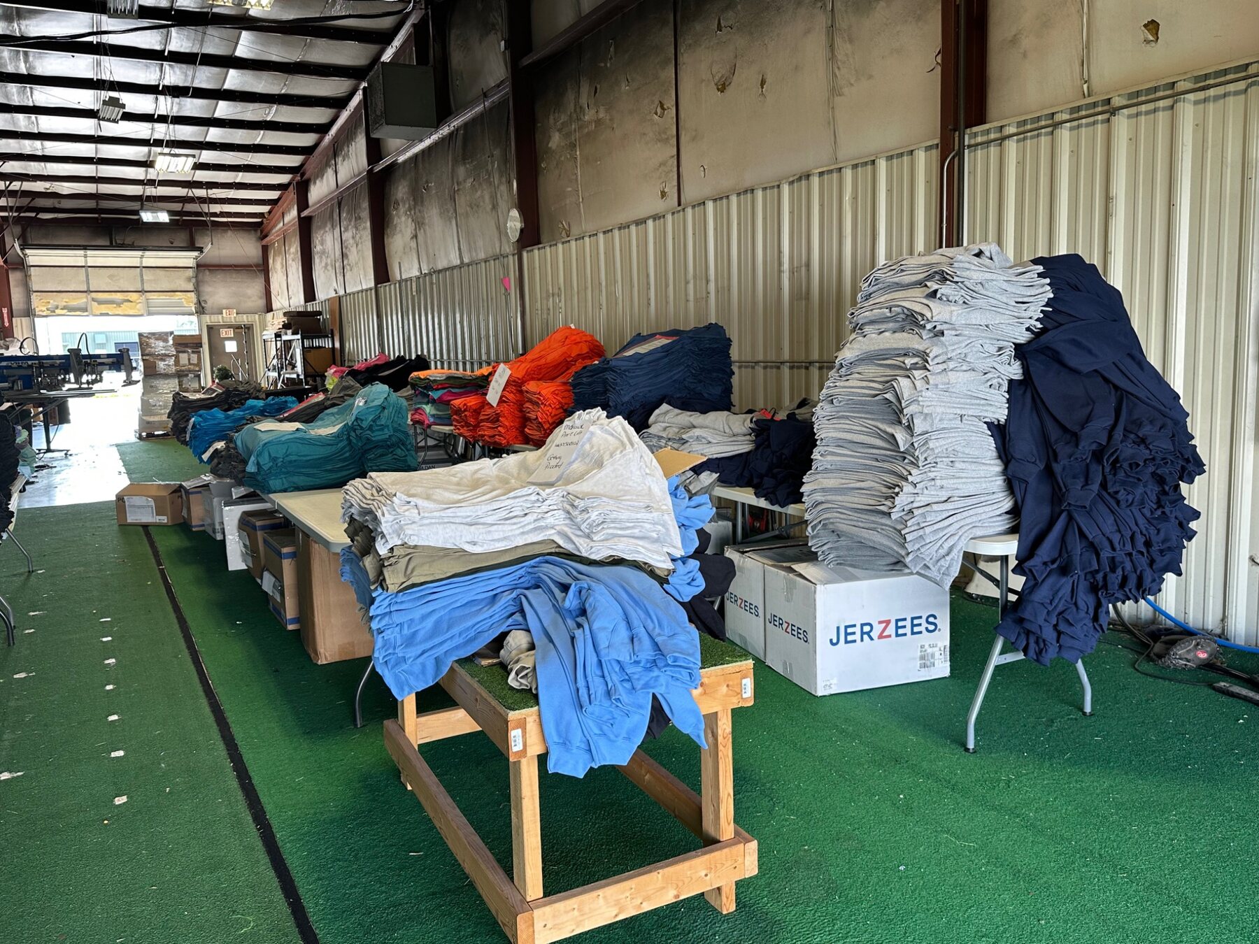 Apparel organized for production and group-order fulfillment at NAS
