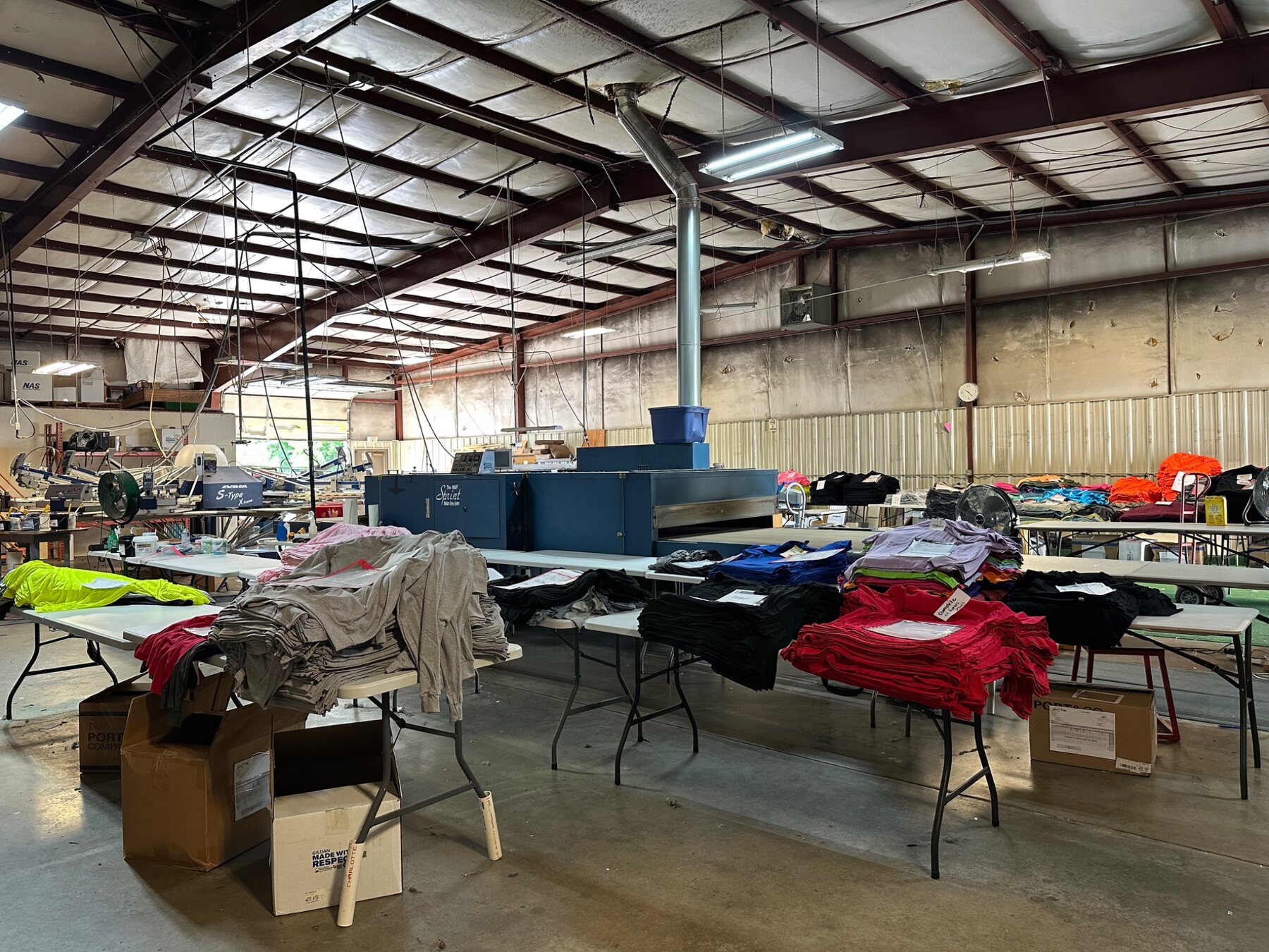 Wide view of NAS apparel production and curing equipment