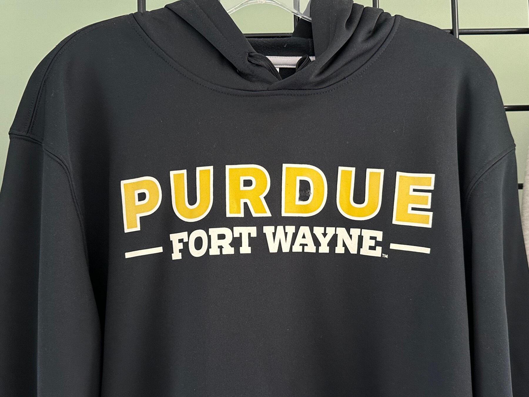 Purdue Fort Wayne print detail on black fabric